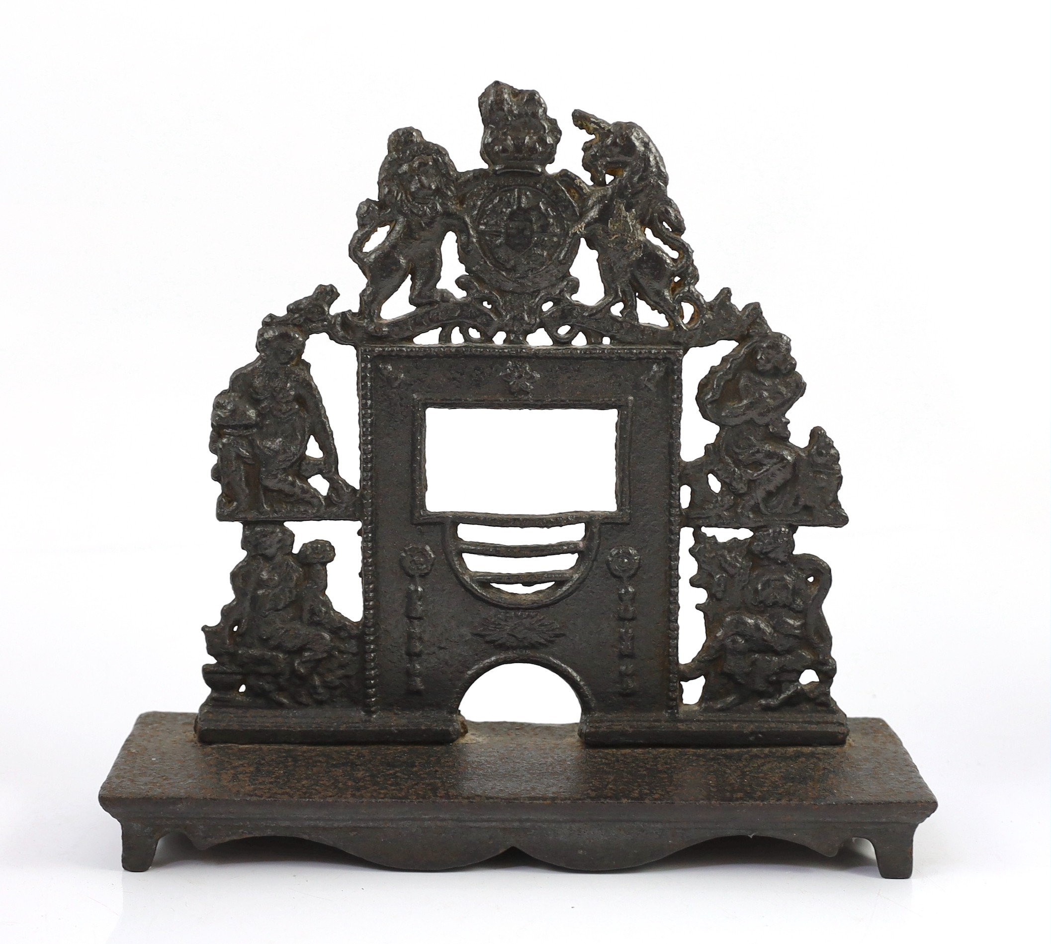 Three early 19th century cast iron model fire grates, two incorporating Royal Arms, largest 12in. wide